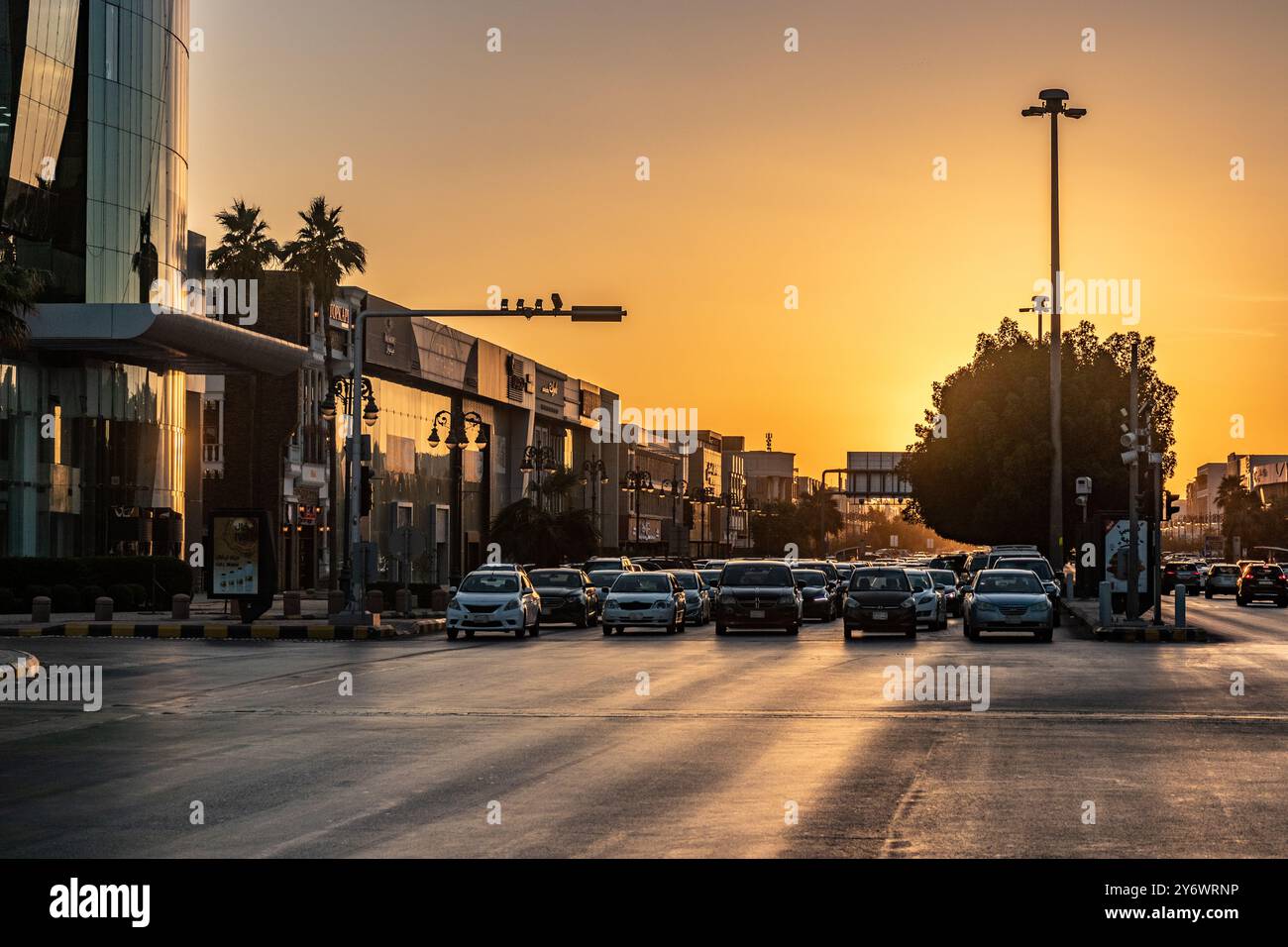 RIYADH, SAUDI ARABIA - NOVEMBER 30, 2021: Road traffic in Riyadh during sunset, Saudi Arabia Stock Photo