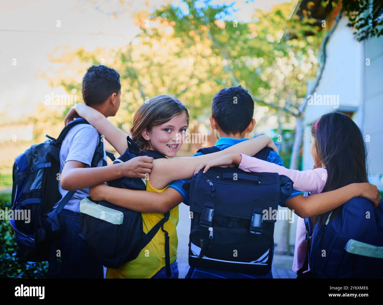 Backpack, school and girl with friends, hug and outdoor with support ...