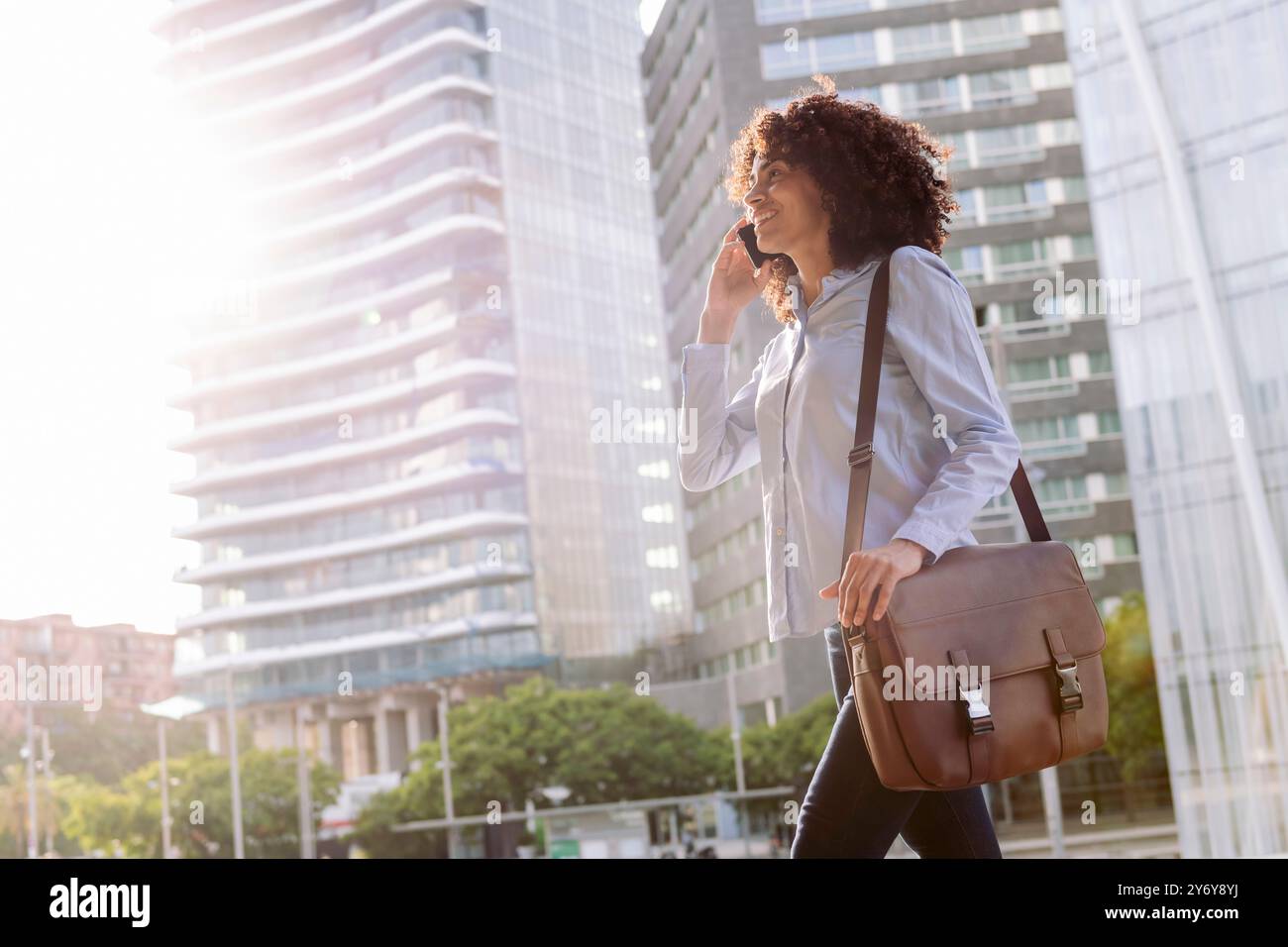 female entrepreneur talking on mobile phone Stock Photo