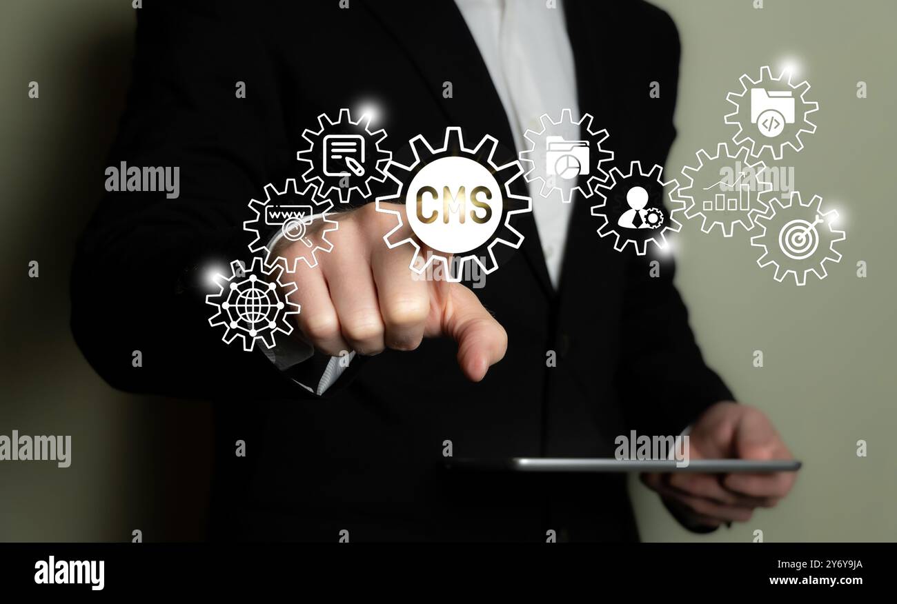 Businessman interacting with a virtual CMS interface, concept of content management system technology. Stock Photo