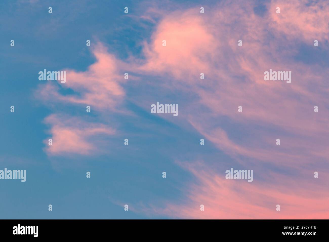 Pink clouds against blue sky Stock Photo