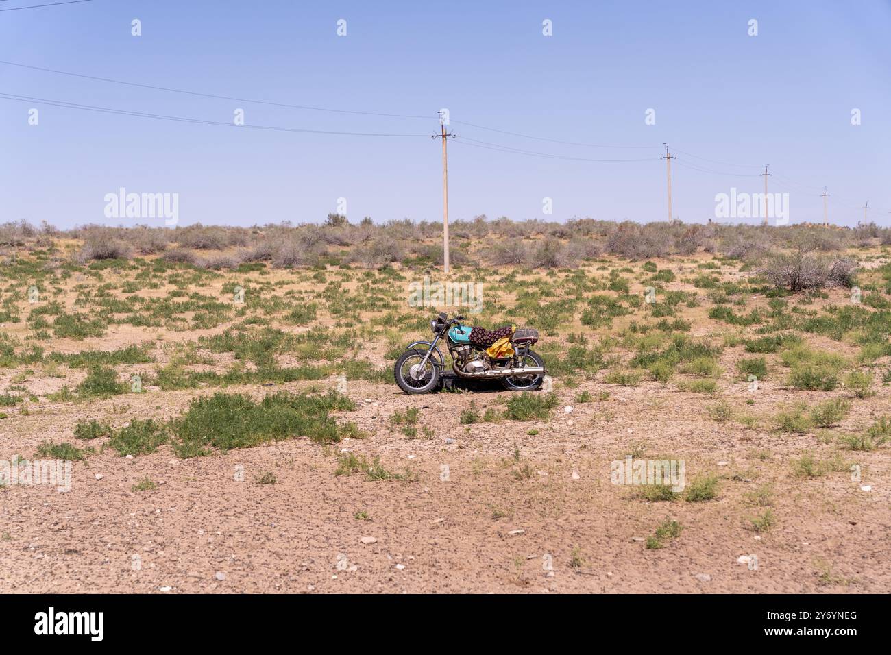A motorcycle is parked in a field of grass Stock Photo - Alamy