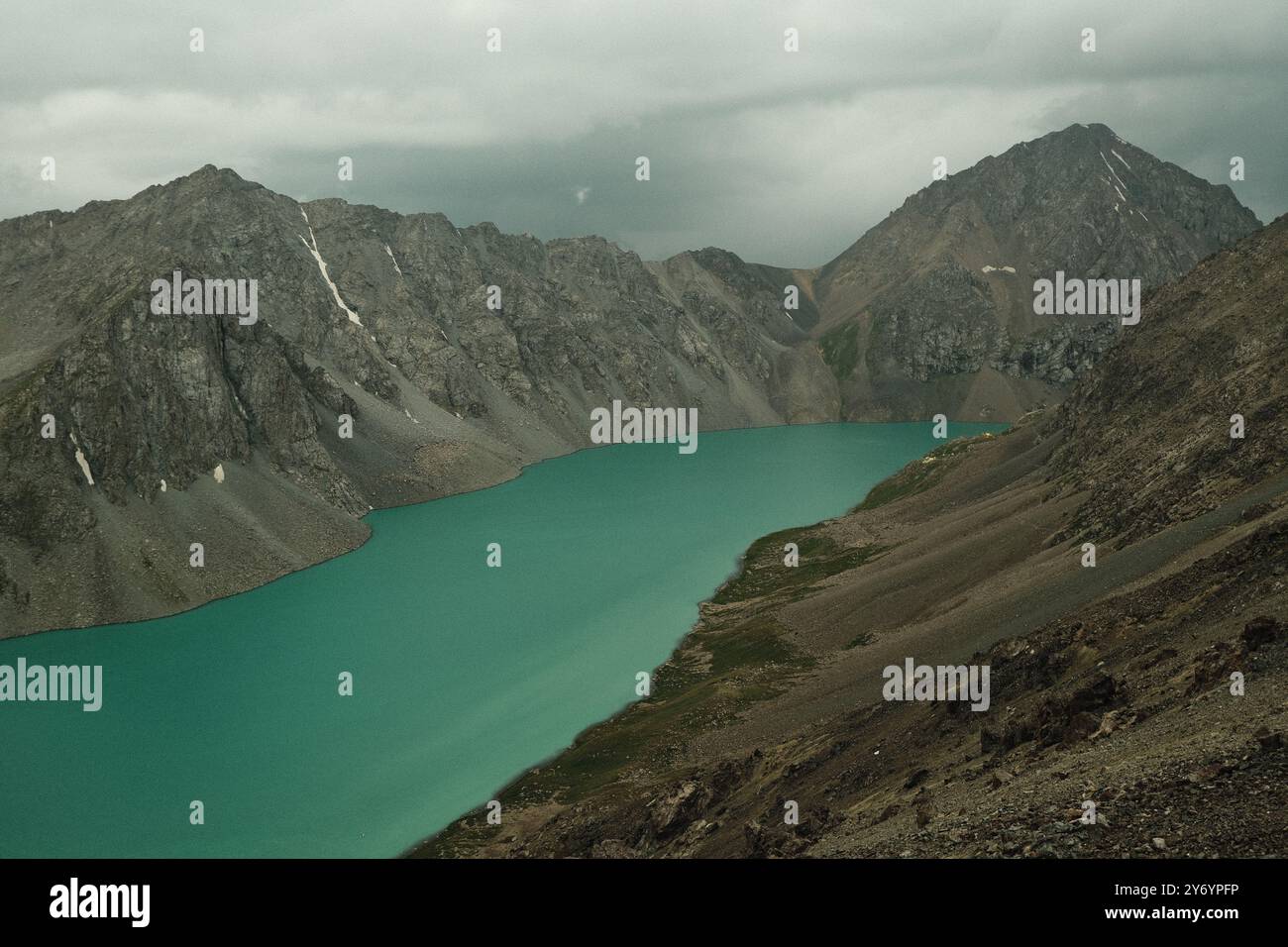 View of karakul lake surrounded by mountains in kyrgyzstan Stock Photo