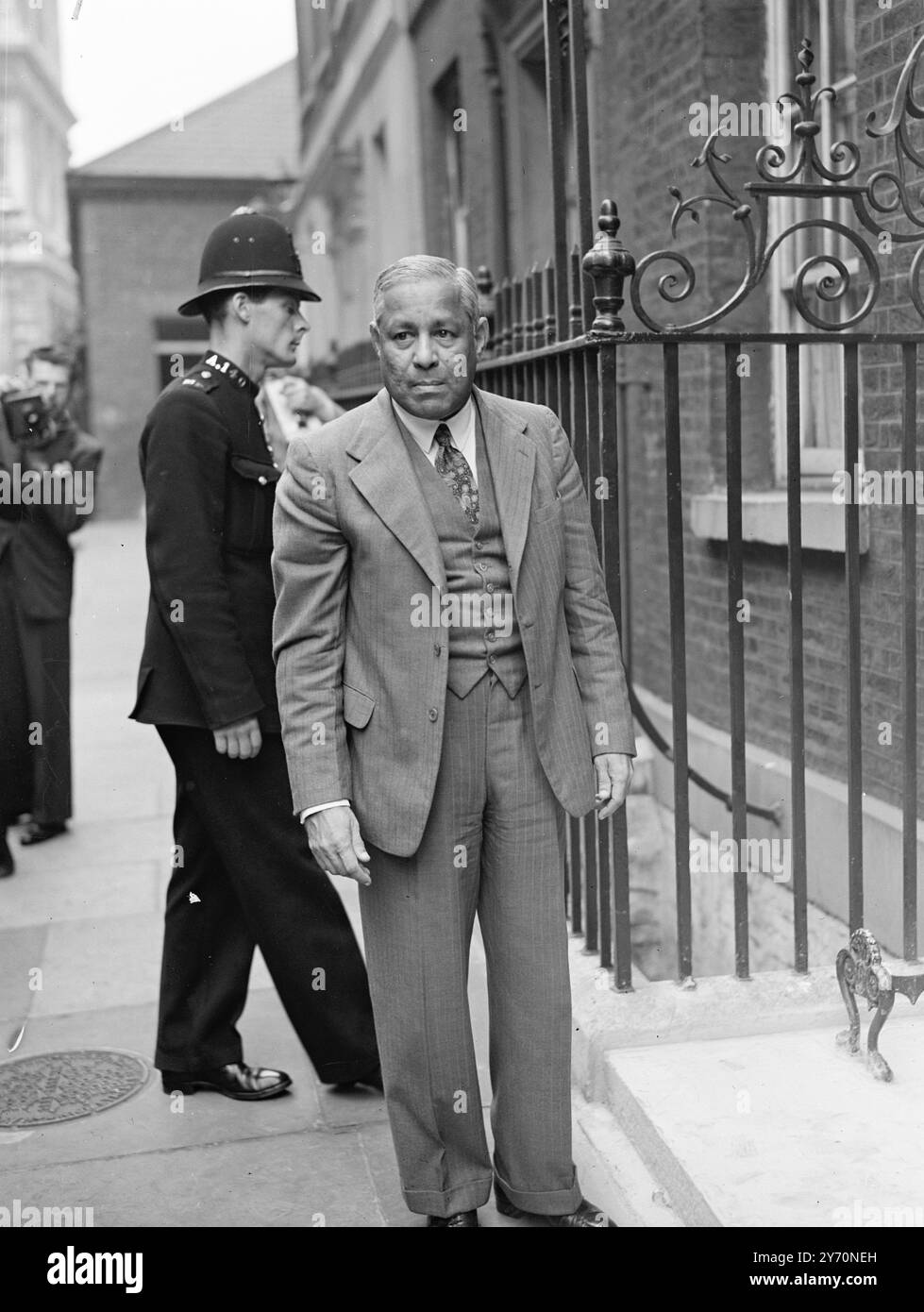 INDIA'S FINANCE MINSTER AT OPENING OF DOLLAR CRISIS TALKS    The Commonwealth talks on the crisis brought about by the diminution in the sterling area's gold and dollar resources were formally opened by the Prime Minister , Mr . Clement Attlee , at No . 10 , Downing Street , London , .    PICTURE SHOWS:- The Hon . Dr. JOHN MATHAI , India's Minister of Finance , arriving at Downing Street for the opening of the talks .     July 13 1949 Stock Photo