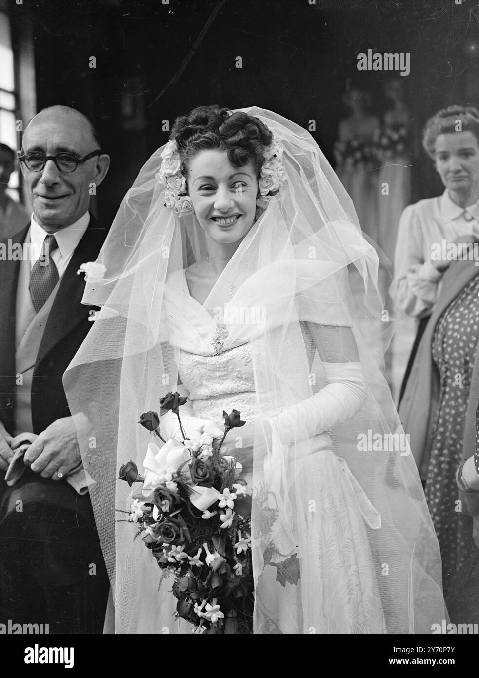 BILLOWING SMILE Miss Audrey Chadwick, aged 20, of Wandsworth London,  smiling out of her foaming headdress as she arrives at Caxton Hall register  office (London) today, for her wedding to Mr.Peter Ernest