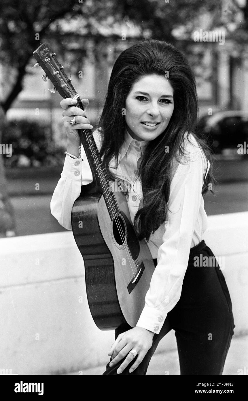 American singing stary Bobbie Gentry with her guitar in London. She is ...
