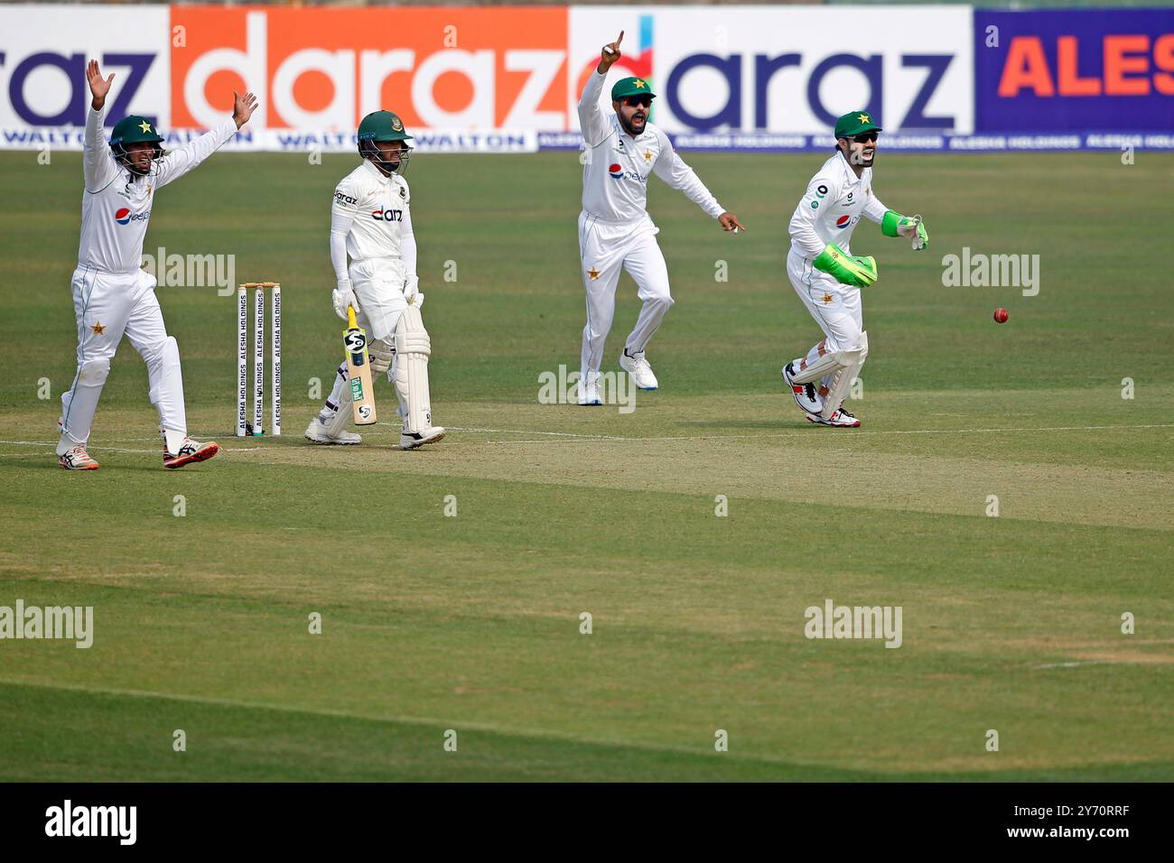 Bangladeshi batter Mominul Haque (2nd left) trap of LBW during Bangladesh and Pakistan first Test match day one at the Zahur Ahmed Chowdhury Stadium i Stock Photo