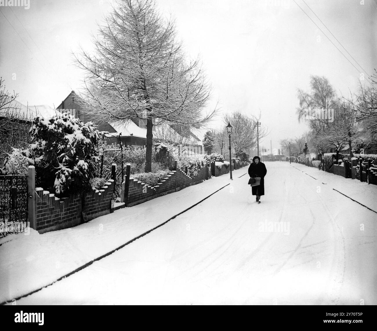 London woman walking street residential Black and White Stock Photos ...