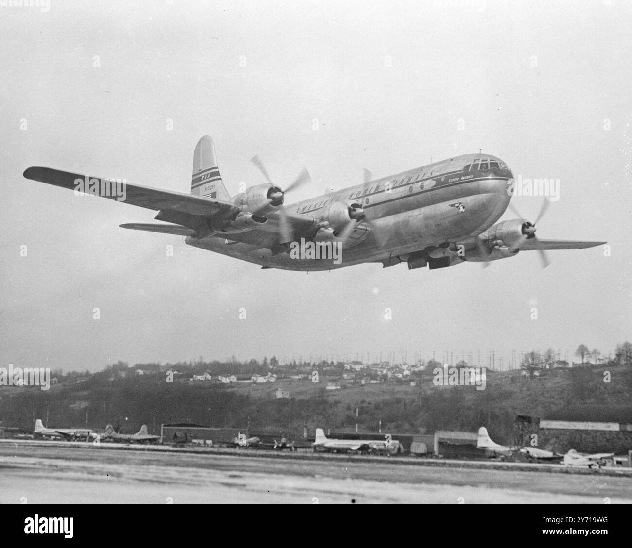 MAIDEN TRANS- ATLANTIC FLIGHT  WORLD'S LARGEST LANDPLANE ARRIVING     The 71 ton Pan American Airways Clipper '' America '' - World's largest commercial landplane - will make make its maiden trans- Atlantic crossing on April 3 , arriving at London Airport at 11 a.m. it is the first of the Boeing Stratocruisers , luxurious American - built airliners, fleet of which will soon be flying between New York and London in 12 hours . The stratocruiser , which has a wing span of 141ft . and length of 110 ft . can seat 75 passengers in conditions of extreme comfort . Powered by four Pratt and Whitney eng Stock Photo