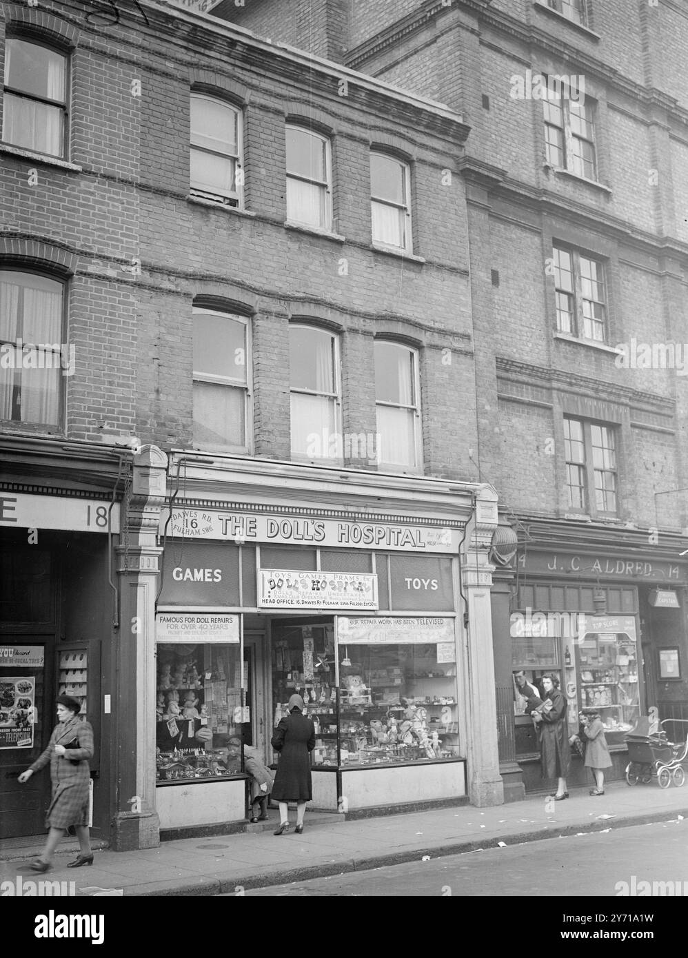 WHERE THE DOCTOR AND HIS WIFE LIVED  LONDON MURDER HUNT    The dolls' hospital in Dawes - road Fulham ( London ) , above which the missing Dr . and Mrs . Archibald Henderson made their home . To acquire the flat Dr . Henderson bought the small building , moving from Ladbroke Square , Notting Hill , two years ago . Acid bath murders.    3 March 1949 Stock Photo