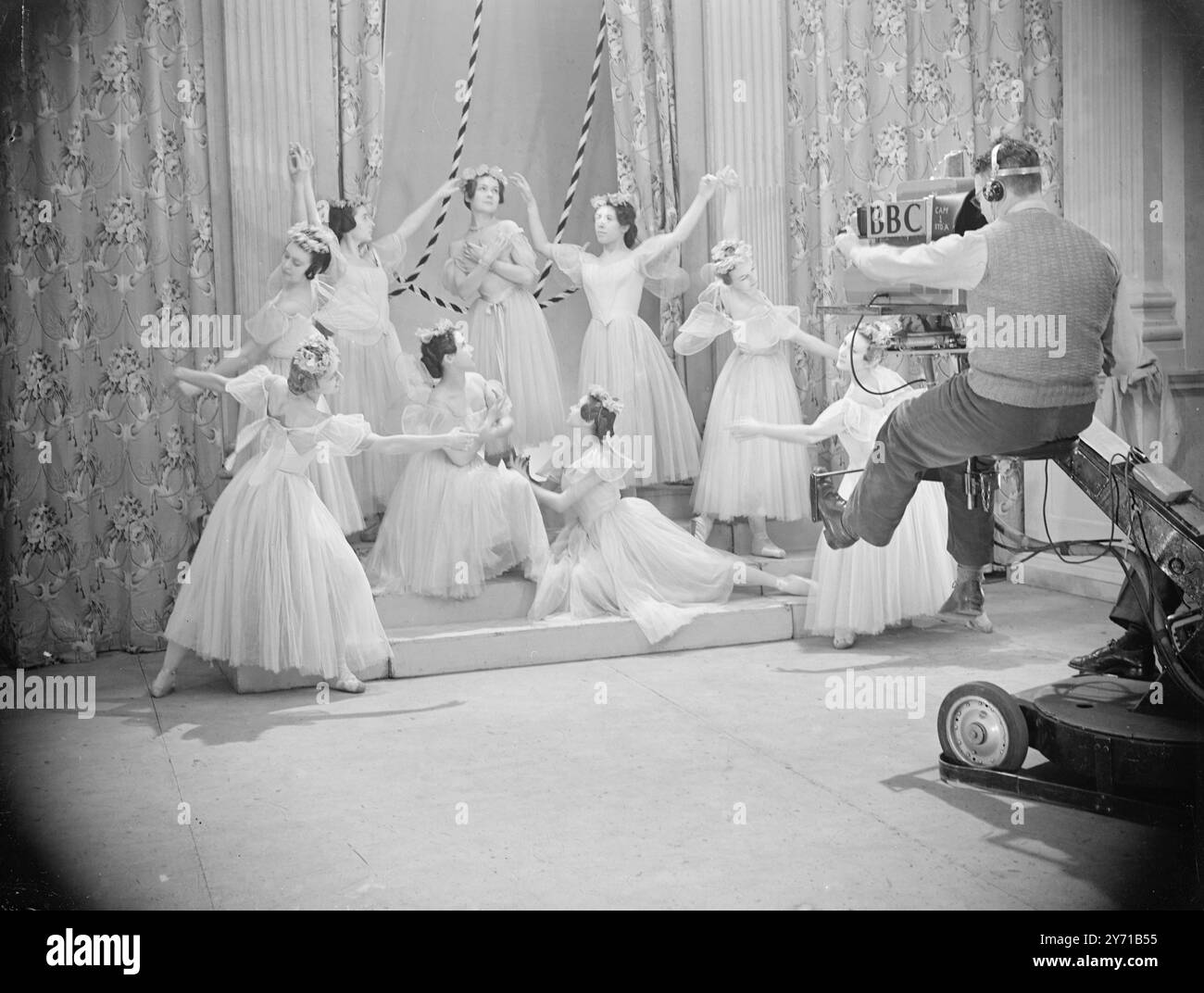REHEARSING  '' BALLET ANGLAISE ''    The Ballet des Champs Elysees , one of the famous French ballet companies visiting England specially for the BBC - television , rehearsed at the Alexandra Palace ( London ) studios for tonight's television broadcasts , which will include the Woodland scene from one of the last great romantic ballets ,  ' La Sulphide ' - a Ballet - Pantomime ''     PICTURE SHOWS :- One of the many tableaux in the ballet  ''' brings the camera - man  '' of his feet '' - during rehearsal .   IRENE SKORIK as '' SYLPHIDE '' , The Woodland Sprite , is in the centre , at the back Stock Photo