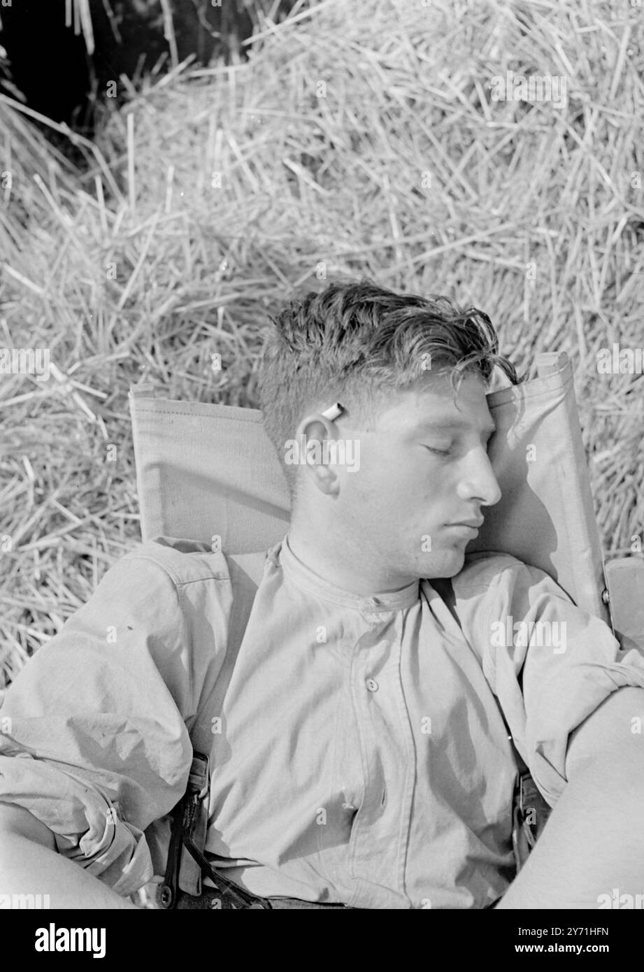cigarette behind the ear Man with a cigarette behind his ear hi-res stock photography and images