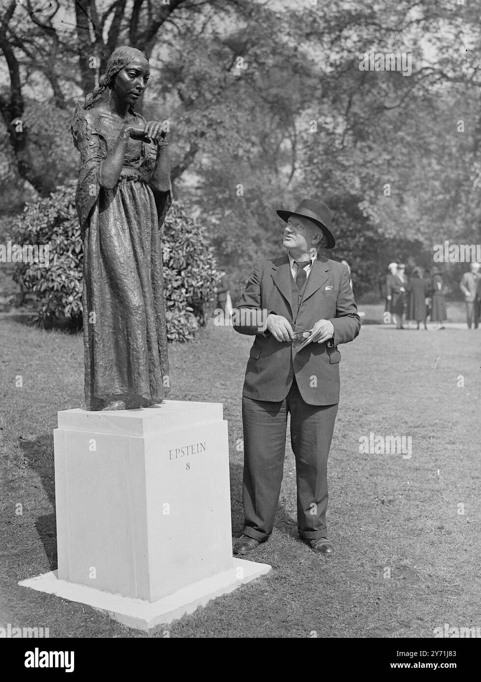 SCULPTURE IN THE PARK   An open-air exhibition of sculpture , including works by Epstein, Robin, Henry Moore , Eric Gill, Maillol, Matisse and many others , was opened at Battersea Park by His Grace the Duke of Wellington , Lord Lieutenant  of the country of London, this afternoon. The exhibitions , which is staged by the London county Council , will remain in the park throughout the summer months.    PICTURE SHOWS:-  Mr. JACOB EPSTEIN pictured looking at his sculpture ' THE VISITATION' at Battersea park today. ARTISTS COPYRIGHT MUST ALSO BE CLEARED    May 13 1948 Stock Photo