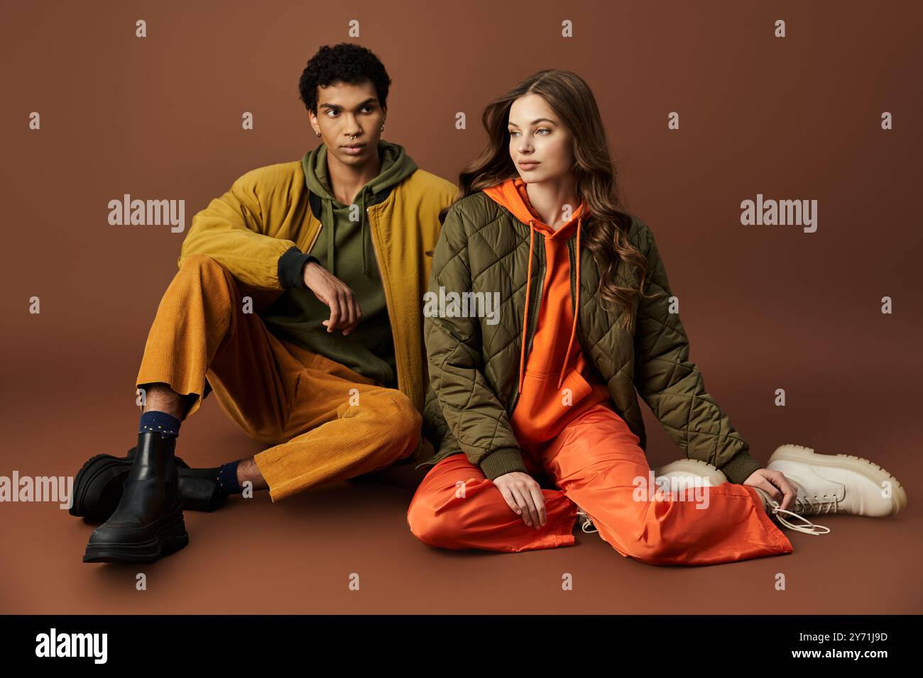 Color Couble Fashionable couple showcases autumn styles with trendy colors and cozy ...