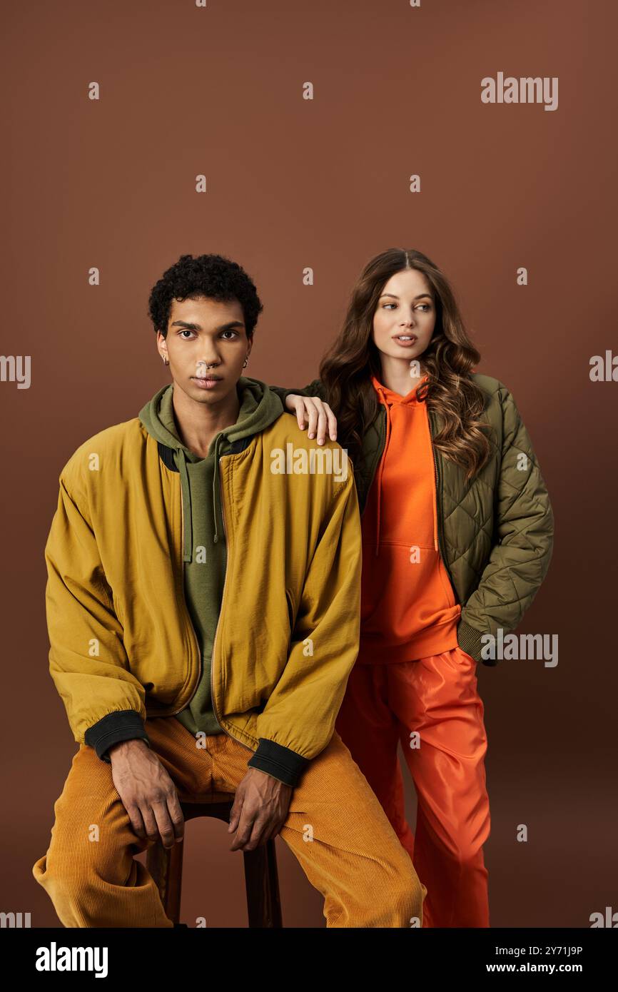 Color Couble The stylish couple showcases vibrant autumn attire, blending colors ...