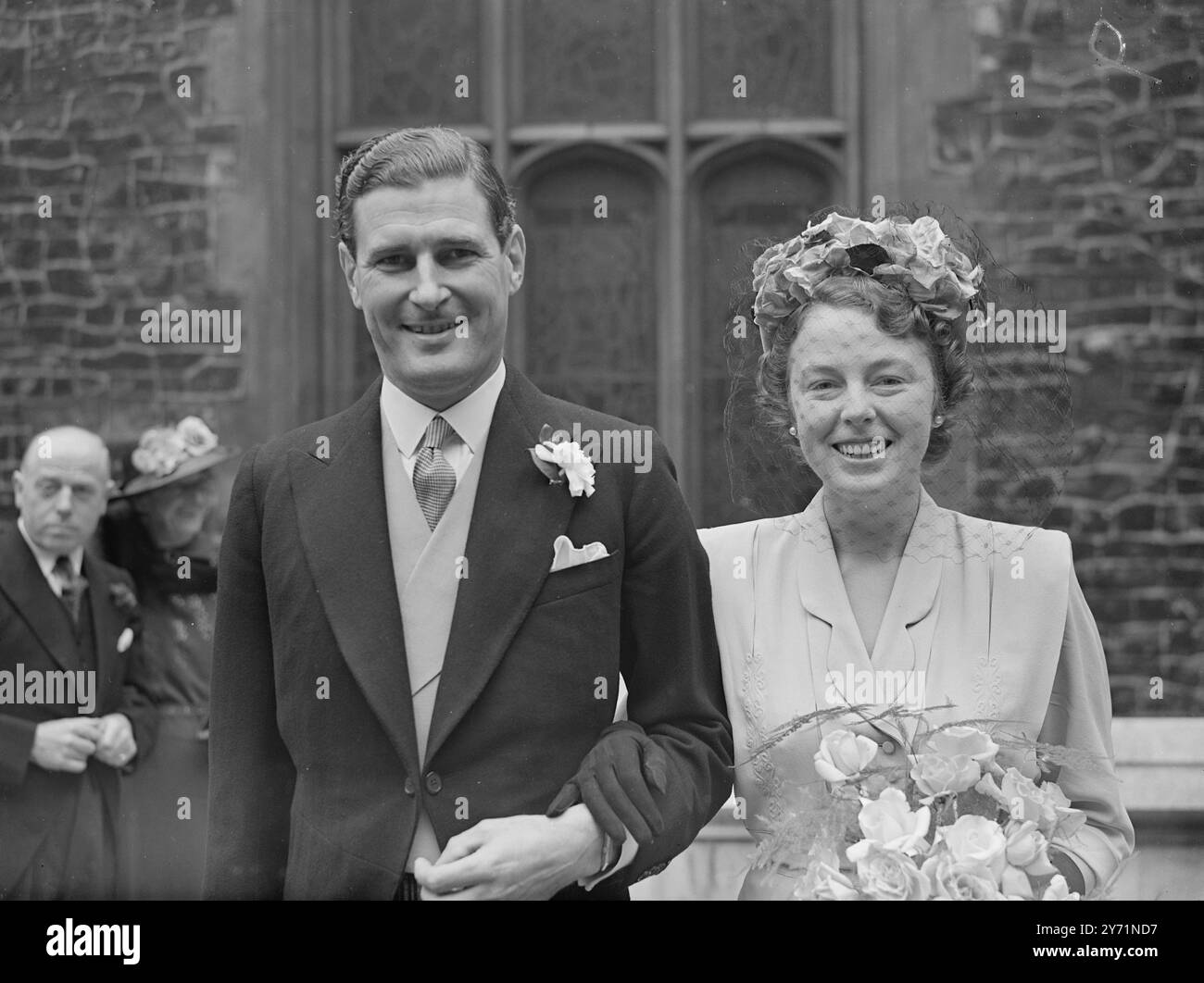 KINGS ' S CHAPEL WEDDING .    Mr C W EDWARDS , of Bridport , was married at the King ' s chapel , the Strand , London .     PICTURE SHOWS :-  The bride and bride groom leaving King ' s Chapel after their wedding .     June 12 1948 Stock Photo