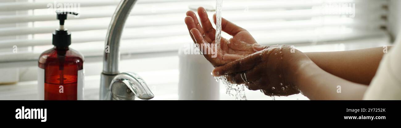 Washing Hands Under Running Water by Sink Faucet Stock Photo - Alamy