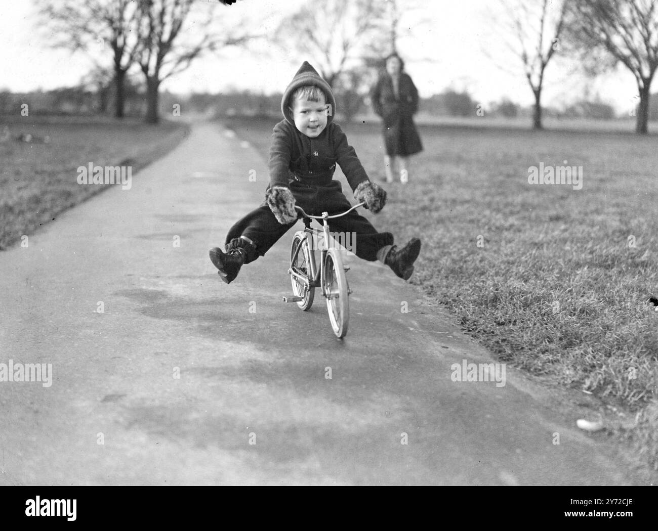 Mervyn Alexander, aged 2 1/2 year, of Bristol, is a keen cyclist who scorns the use of a kiddies tricycle. His daddy, an aircraft fitter has built him a true to scale fixed wheel bicycle, one third the size of a normal machine. 16 February 1946 Stock Photo