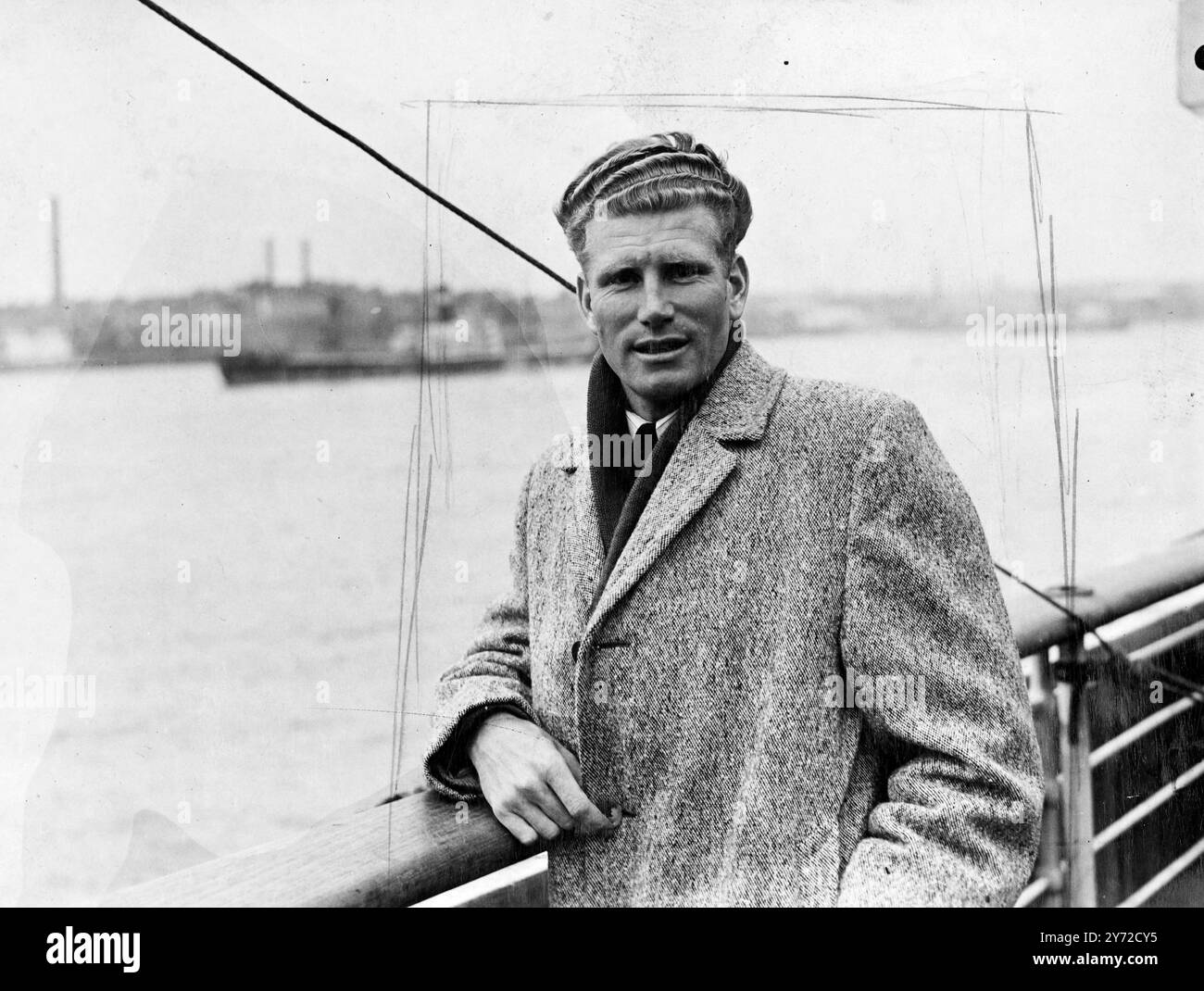 New Zealand champion, arrives. One of the passengers to arrive at Tilbury from New Zealand aboard the MV 'Rangitiki' today, was the champion runner from 'down under' Douglas Harris. He hopes in the near future to approach the great record of his fellow countrymen Jack Lovelock, and has already done the half mile in one minute .4 9.4 seconds, which is only 1/5 of a second outside Wodderson's world's best. Harris is to take up because of physical education at Loughborough College. During his stay here, and will probably represent his country in next year's Olympic Games.  Photo shows, Douglas Ha Stock Photo