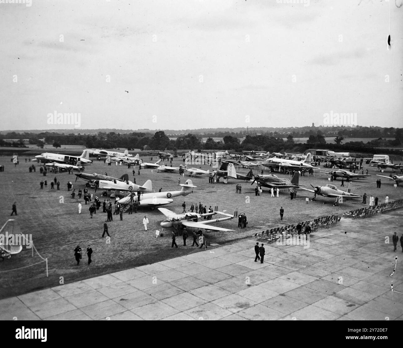 World's greatest air show will boost British exports. 6000 guests from all over the world are attending the world's greatest aircraft exhibition and fly display which opened today at the Handley Page Aerodrome at Radlett, Herts. Over 70 different aircraft, ranging from giant airliners, jet propelled military aircraft and private owner planes to gliders, there to attract the foreign buyers. The show is organised by the Society of British Aircraft Constructors.  Photo shows, a general view of the exhibition of aircraft, which opened at Radlett, Herts, today (Tuesday).  9 September 1947 Stock Photo