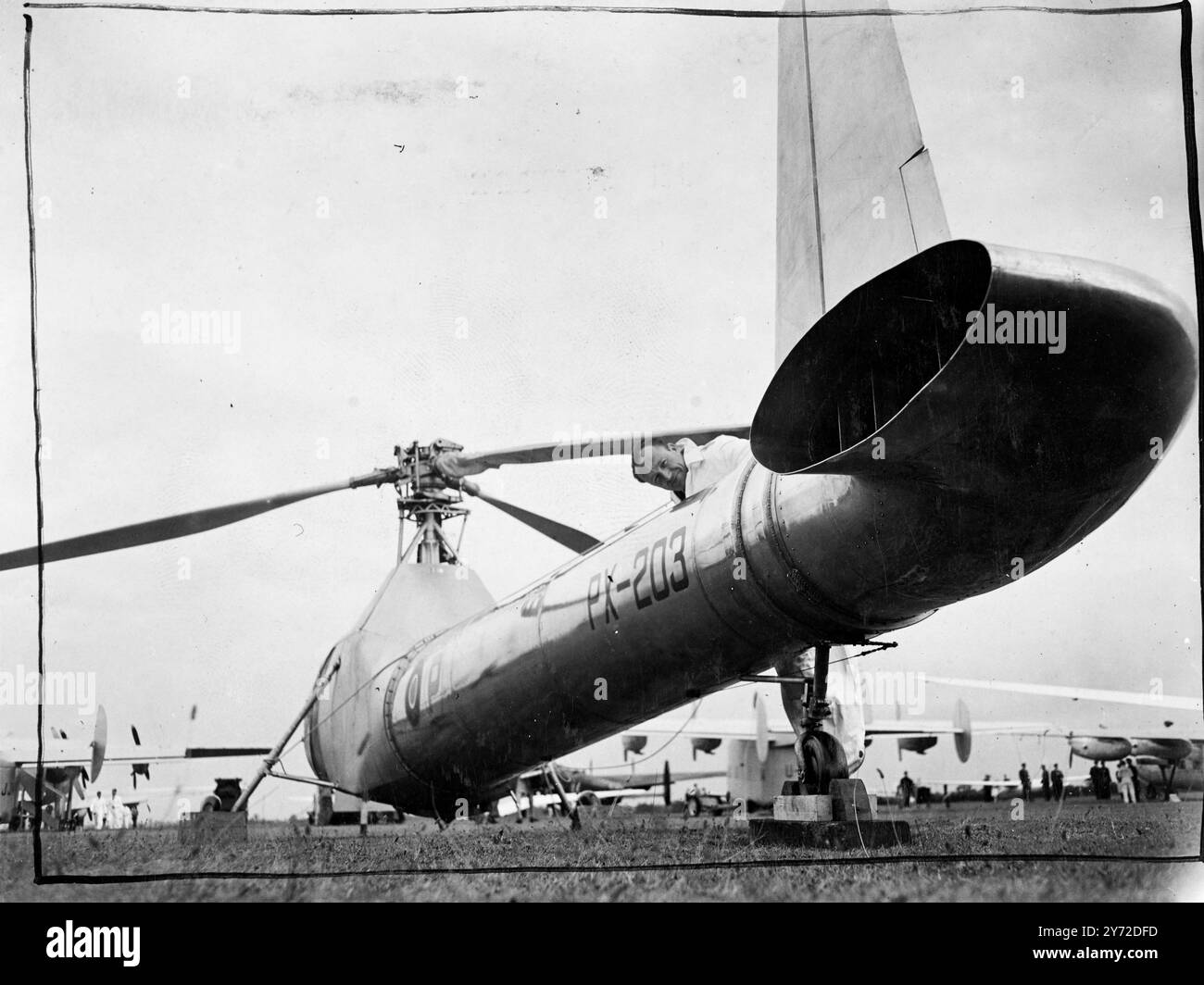 World's greatest air show will boost British exports. 6000 guests from all over the world are attending the world's greatest aircraft exhibition and fly display which opened today at the Handley Page Aerodrome at Radlett, Herts. Over 70 different aircraft, ranging from giant airliners, jet propelled military aircraft and private owner planes to gliders, there to attract the foreign buyers. The show is organised by the Society of British Aircraft Constructors.  Photo shows, an unusual view of the 'Flying Drainpipe'the Cierve W9 helicopter. In this aircraft the normal torue compensating screw at Stock Photo