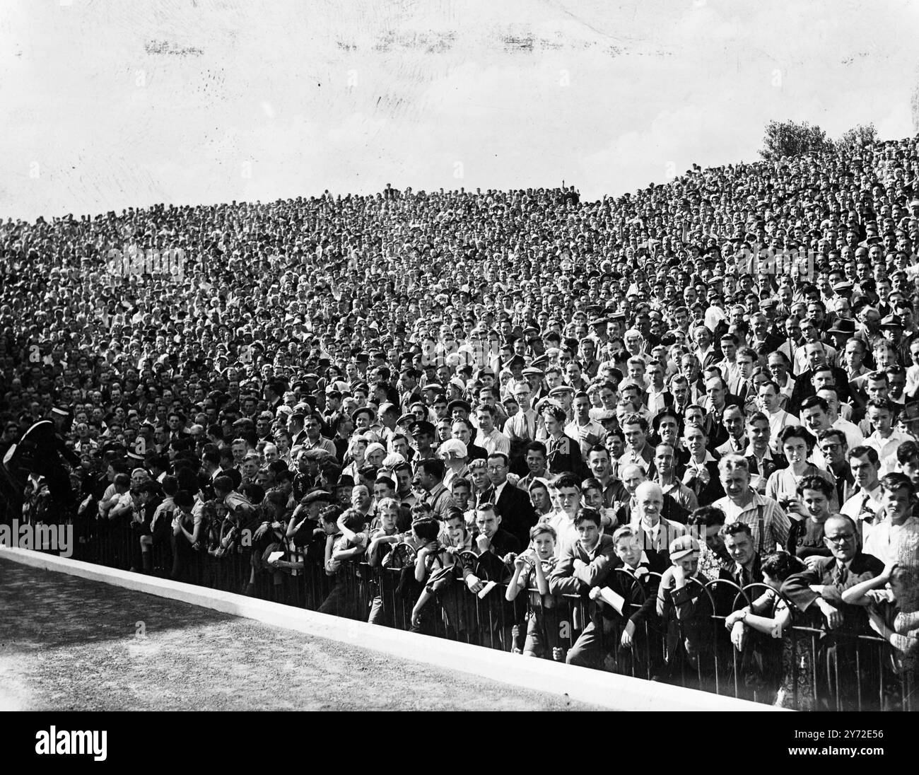 One million soccer fans welcomed the opening of the season when a full table of matches was played in all departments of the English and Scottish Leagues. Highbury Stadium was packed with spectators eager to see the Arsenal open the season against Sunderland, with Roper, £11,000 right-winger from Southampton, and £10,000 Macaulay right half from Brentford, making their first appearance for the London side. - - Picture shows: late comers to Highbury Stadium this afternoon found the case closed. Here is part of the capacity crowd, which saw Arsenal's first game. - - 23 August 1947 Stock Photo