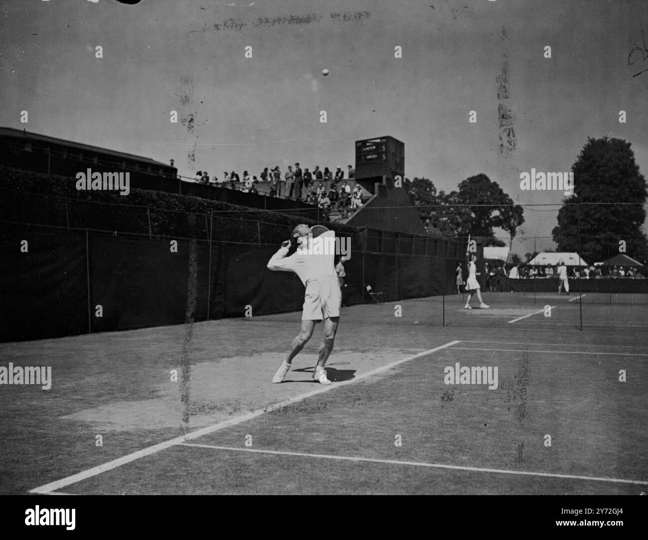 H.Redl of Austria, who lost an arm during the war, is pictured here serving during his game against M Ellmer, of Switzerland. Redl scored a great win over his opponent today by 6-2, 2-6, 6-3, 6-4. He has overcome his handicap when serving by throwing the ball into the air with his racket. 24 June 1947 Stock Photo