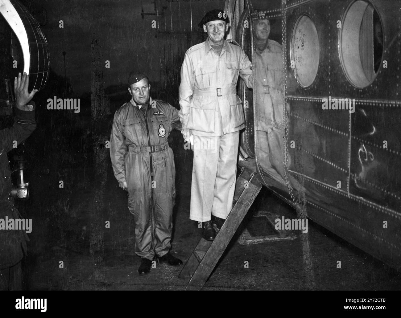 Field Marshal Viscount Montgomery of Alamein, Chief of the Imperial Gen. Staff, pictured with his pilot at the hatchway of the aircraft in which he left Northo pilot lt to tour the world. 21 June 1947 Stock Photo