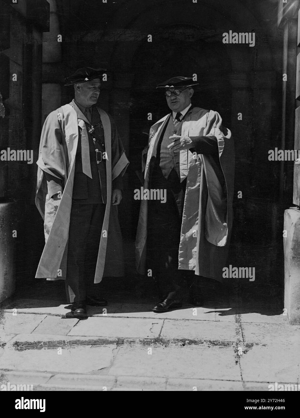 The Foreign Minister Mr Ernest Bevan, and Lord Wavell, were among those given an Honourary Degree of Doctor of Laws at Cambridge University today.  Introducing Mr Bevin in the customary Latin,  the public orators described him in the words of Cicero  - 'a true man of the people labouring for the people's good'. Lord Wavell he described as 'a faithful servant of his country in war and peace, and a follower of Muses'. In all, eleven honorary degrees were conferred. Picture shows: Mr Ernest Bevan (right) with Lord Wavell, dressed in their ceremonial robes, pictured together after receiving their Stock Photo