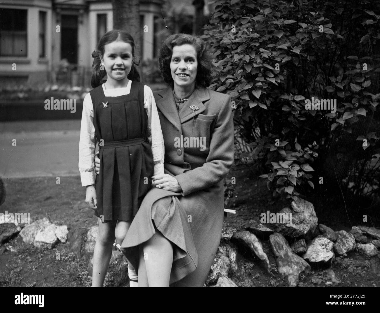 Mrs Kathleen Barratt wife of RAF Warrant Officer Reginald Barratt, who has been missing since he appeared before a Russian Field.  She is seen at their home in Leicester with their dauther Kathleen.  26 May 1947 Stock Photo