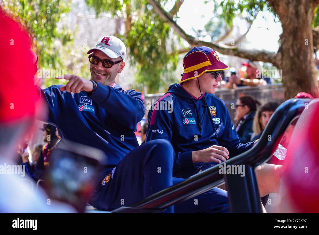 Melbourne, Australia. 27th Sep, 2024. Josh Dunkley (L) and Logan Morris (R) of Brisbane Lions are seen during the event. Australian Football League Grand Final Parade and Footy Festival taking over in Yarra Park in front of Melbourne Cricket Ground Stadium ahead of AFL?Grand Final. The event features entertainment for all ages including player appearances, giveaways, AFL Play zone, music and some of Melbourne's best food trucks and bars. Credit: SOPA Images Limited/Alamy Live News Stock Photo