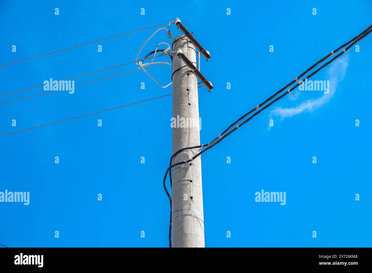 electric pole with lines and wires against blue sky Stock Photo - Alamy