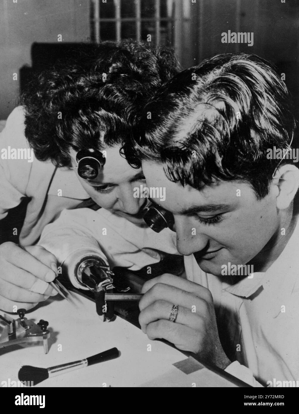 Man with artificial hand lands craft at the Bulova watch company school ...