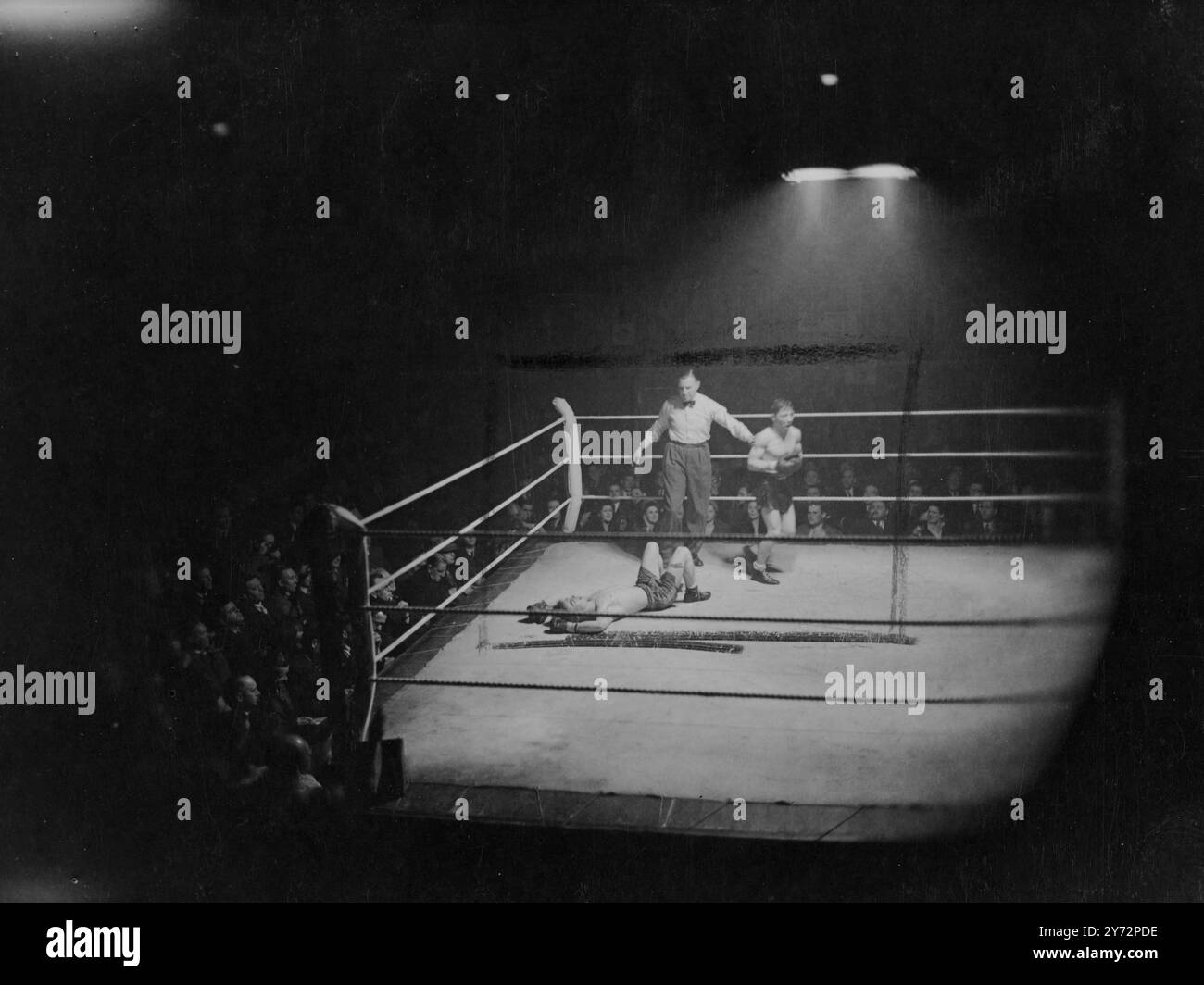 Cerdan knocks out Gilroy. Marcel Cerdan, middleweight champion of France, knocked out. Bert Gilroy, Scottish cruiserweight champion, in the fourth round of their contest at the Seymour Hall, Marylebone, London tonight (Tuesday).  Photo shows, the knockout ! Gilroy down to stay in the fourth round of the fight tonight (Tuesday)  11 February 1947 Stock Photo