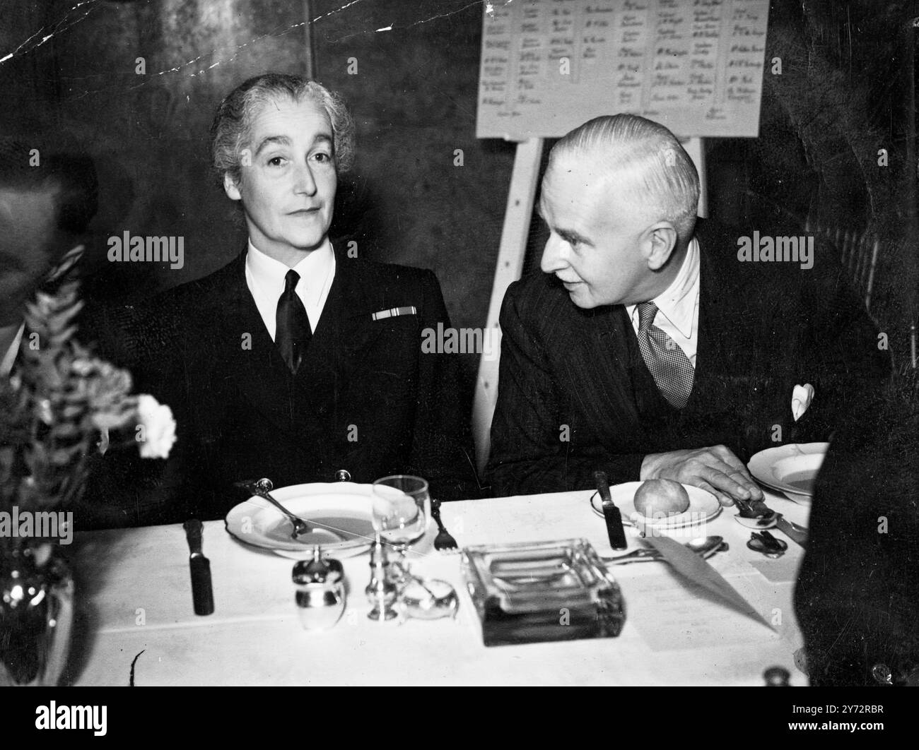 Farewell luncheon to South Africans. Simpson's Service Club in Piccadilly became famous during the war years for Service luncheons. On Tuesday,6 November 1945, a lunch was held in honour of South Africans who are surely returning to the Union.  Photo shows, on the left, Lady Cholmondley in conversation with Sir Cecil Weir.  7 November 1945 Stock Photo