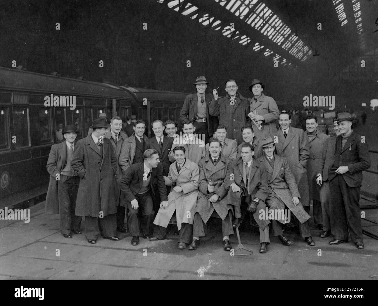 The first contingent of British settlers to leave for Australia under the migration agreements signed between the governments of the United Kingdom and Australia left London for Tilbury. They are 200 single ex-service building tradesmen. They sail for their new country on the ship 'Largs Bay'. Picture shows: some of the 200 emigrants builders photographed at St Pancras station.  1 December 1946 Stock Photo