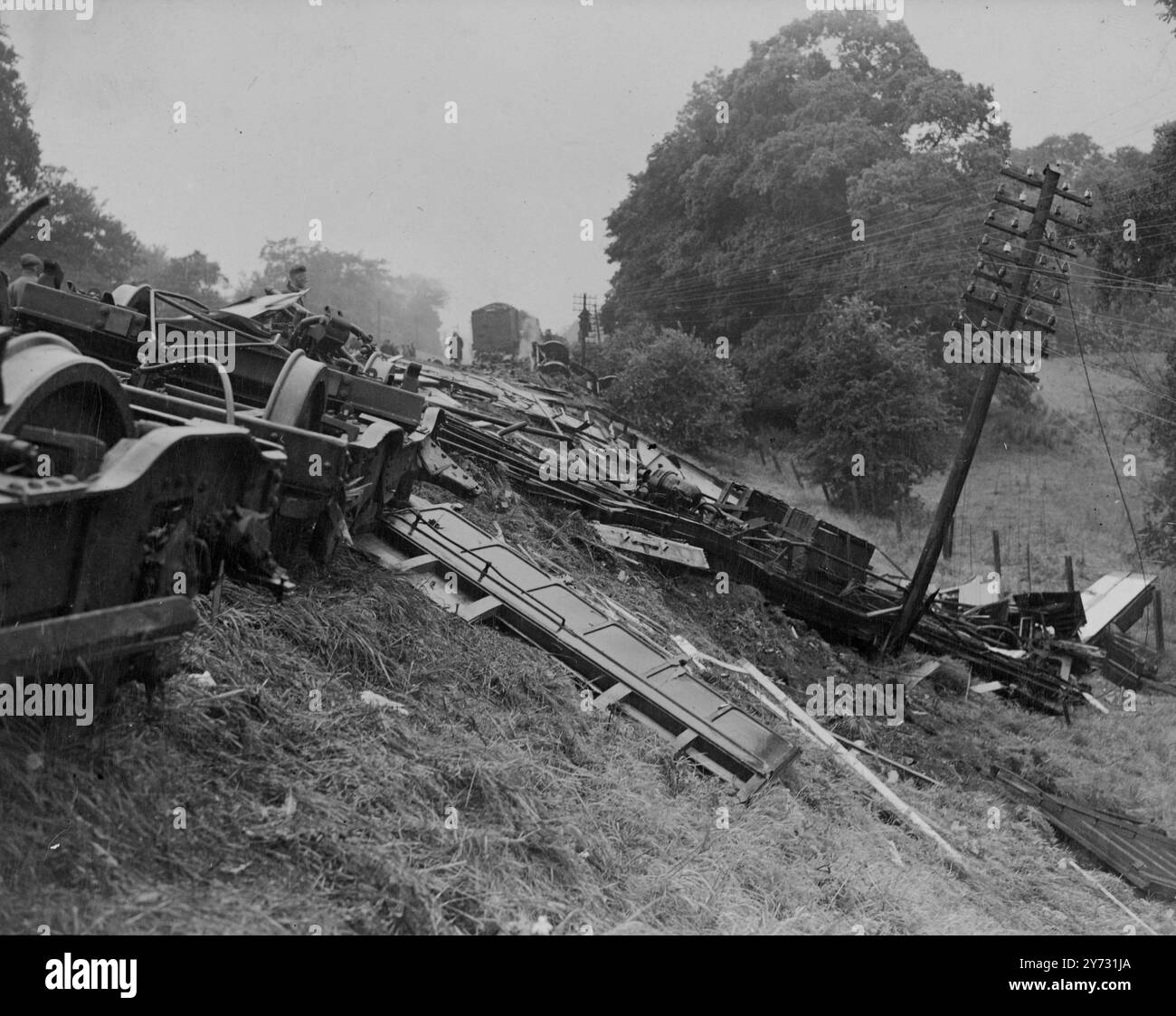 Express crash line still blocked. All four lines were still blocked this morning (Tuesday) at the site of the King's Cross Aberdeen express derailment at Hatfield, Herts, last night (Monday). Breakdown gangs have worked all night to clear the line, and all fast and slow traffic in both directions is expected to be restored later today. More than half a mile of track on three lines must be repaired where the express left the rails, twisting the metals into grotesque shapes and cutting sleepers clean in two. There was only one seriously injured person among the 11 casualties in the wreck, for wh Stock Photo