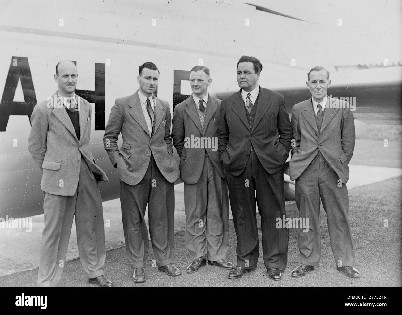 Wayfarer down in Atlantic. The B.A.C.'S Wayfarer machine, flying across the southern Atlantic from Bathurst, West Africa to Natal, Brazil, on its trip to South America, made an emergency landing in the sea near the coast of Brazil. All members of the crew picked up by American ship.  Picture shows, taken before the Wayfarer left for her flight, members of the airliners crew, all of which have been picked up. Left-to-right E H Newman (pilot), Airwork Ltd, G A Campbell, B A C Engine Service Engineers, R Ellison, B A C, Test Pilot (co-pilot), J E W Martin, Air Work Ltd, (Wireless Operator), E W M Stock Photo