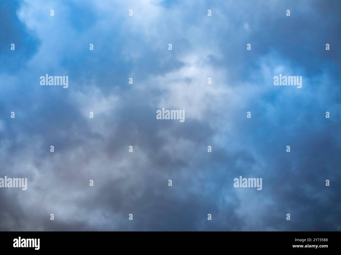 A dramatic sky, colorful sky, before storm and during sunset. Huge clouds formations. Stock Photo