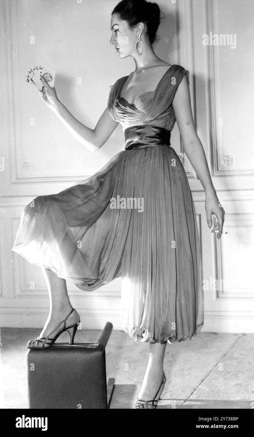 Jacques Fath design - a feminine trousered dress in the Turkish manner . Nile  green chiffon is medium with high satin waistband in a darker shade.  Emerald rhinestones , Roma earrings ,