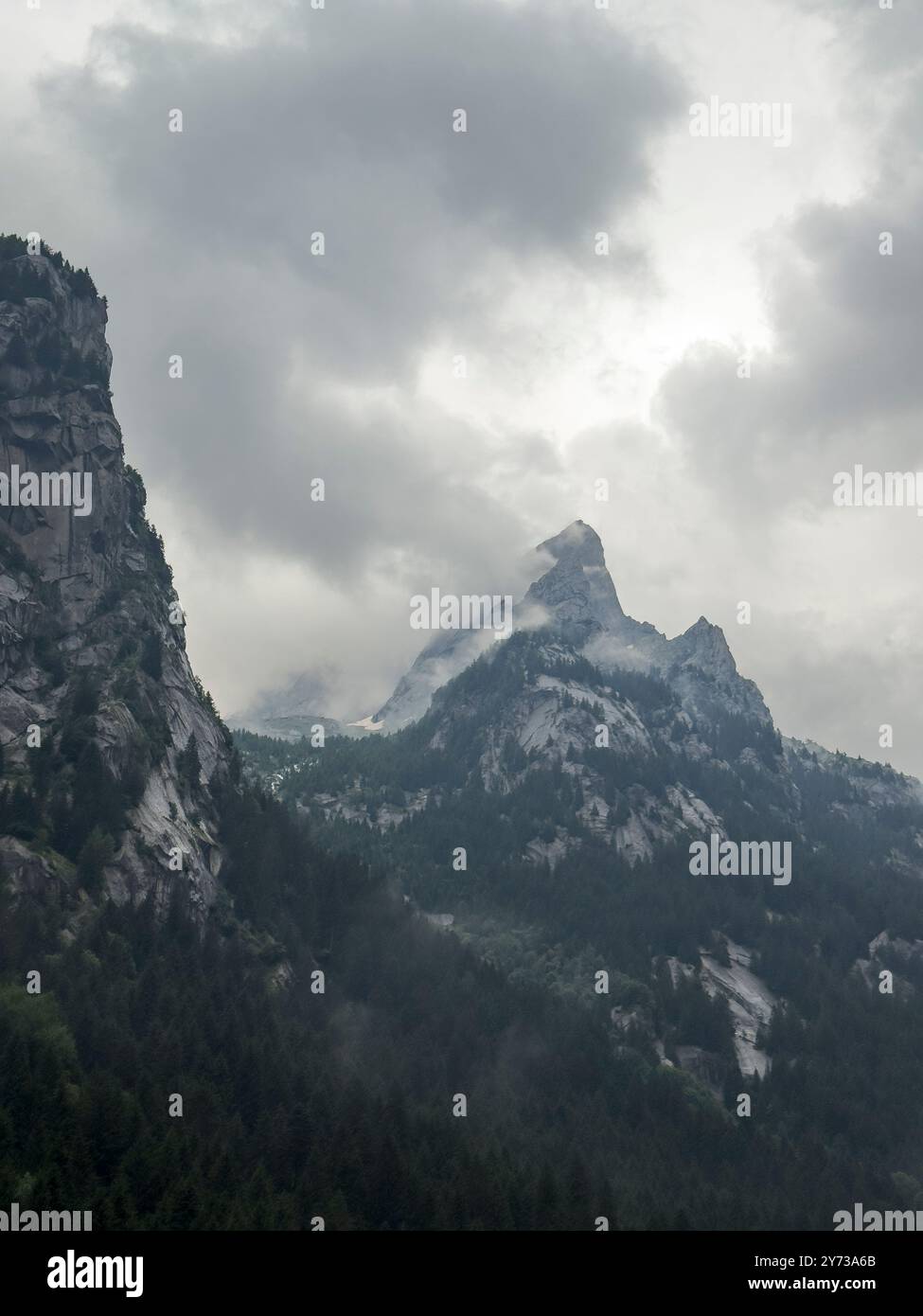Mountain peak shrouded in misty hi-res stock photography and images - Alamy