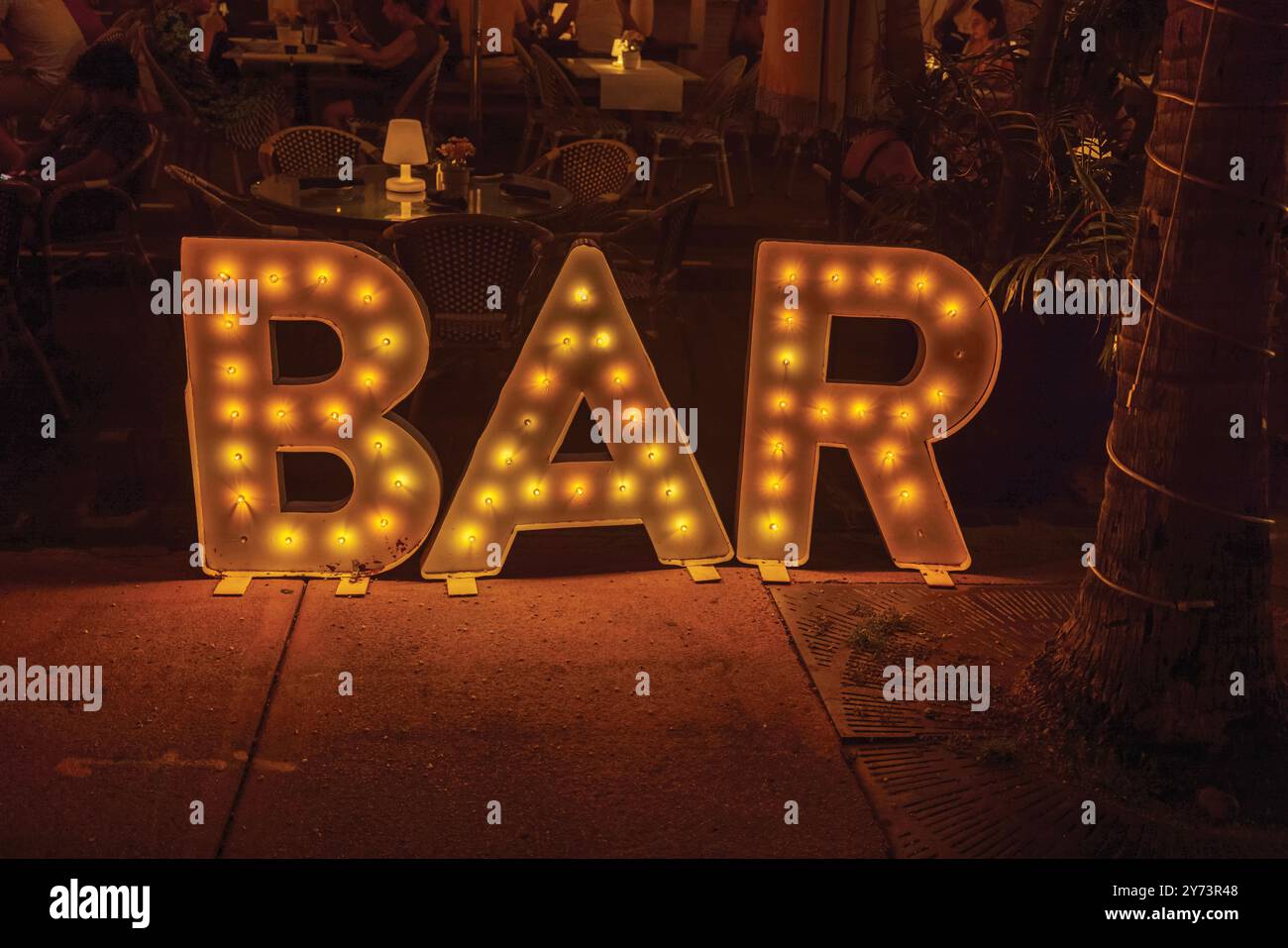 Illuminated bar sign at night on Collins Avenue, Miami Beach. USA Stock ...