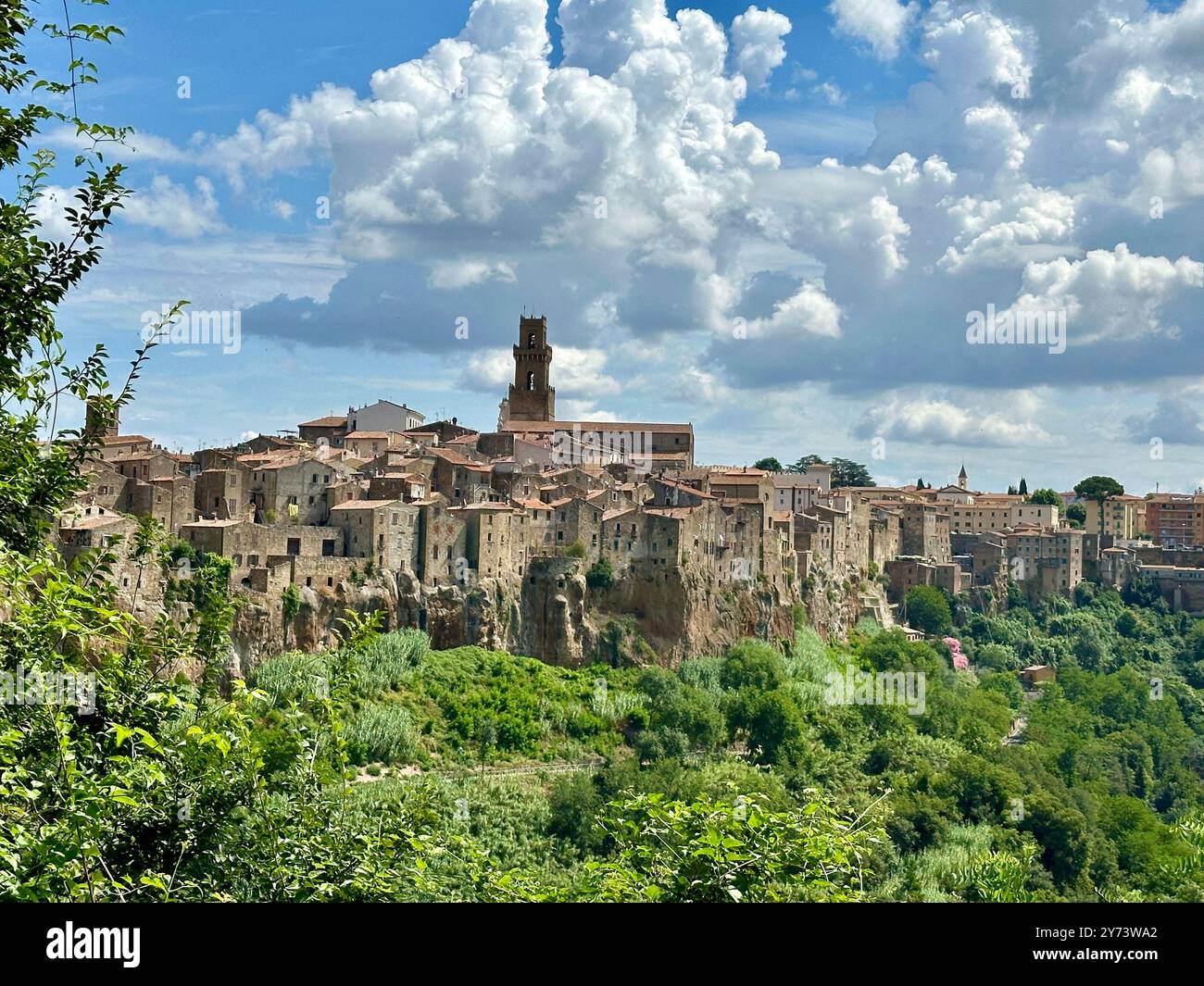 The photograph depicts a medieval stone city landscape, showcasing architectural details in the summer. - Smartphone Captured Stock Image