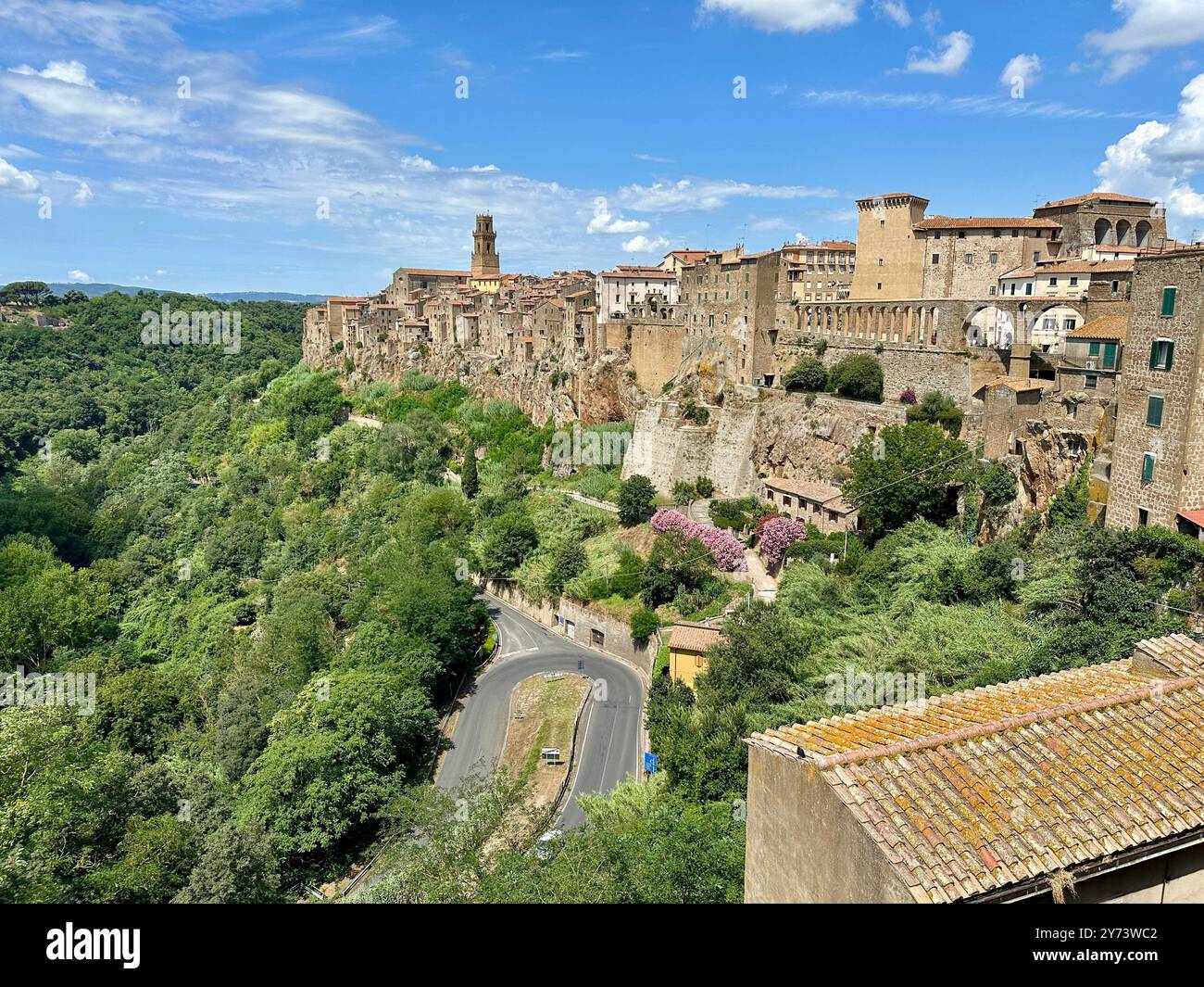 The photograph depicts a medieval stone city landscape, showcasing architectural details in the summer. - Smartphone Captured Stock Image