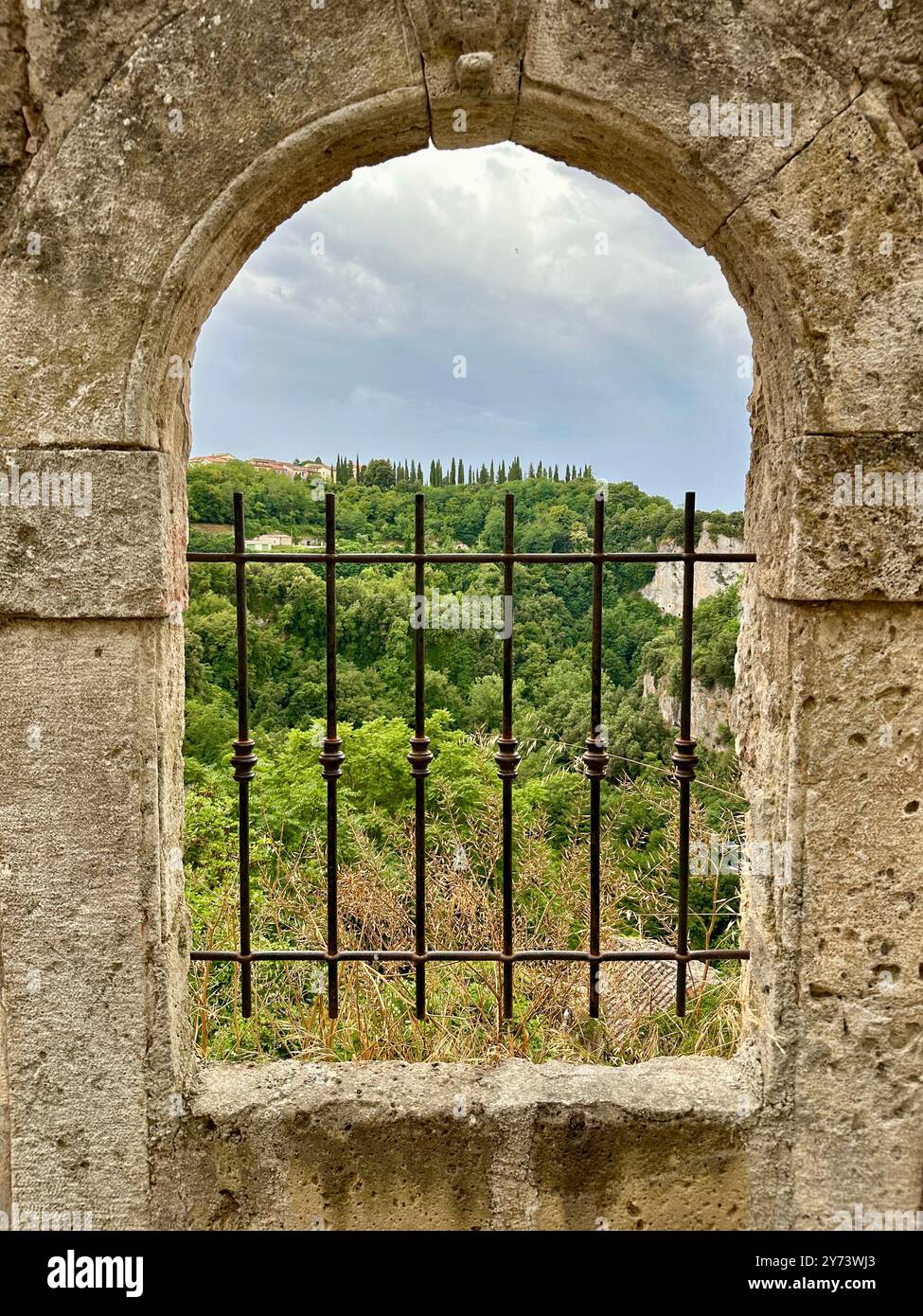 The photograph depicts a medieval stone city landscape, showcasing architectural details in the summer. - Smartphone Captured Stock Image