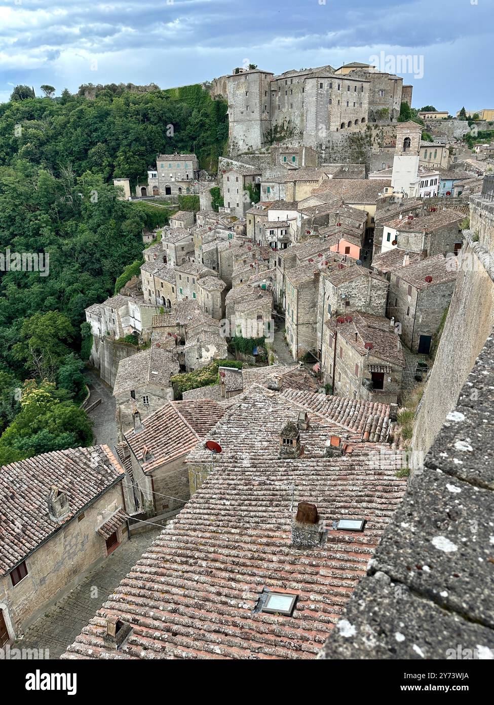 The photograph depicts a medieval stone city landscape, showcasing architectural details in the summer. - Smartphone Captured Stock Image