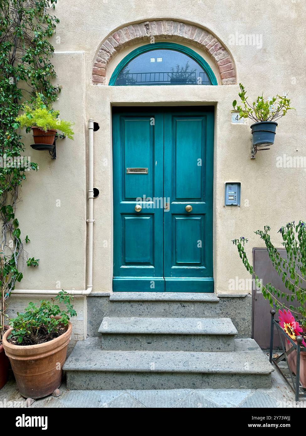 The photograph depicts a medieval stone city landscape, showcasing architectural details in the summer. - Smartphone Captured Stock Image