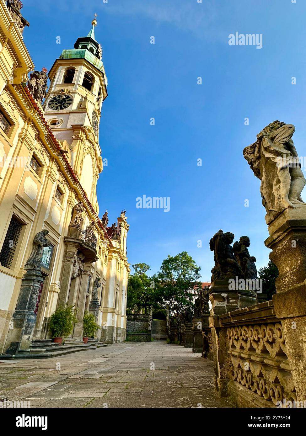 The photograph showcases a medieval European cityscape in summer, featuring vibrant rooftops and intricate architectural details. - Smartphone Captured Stock Image