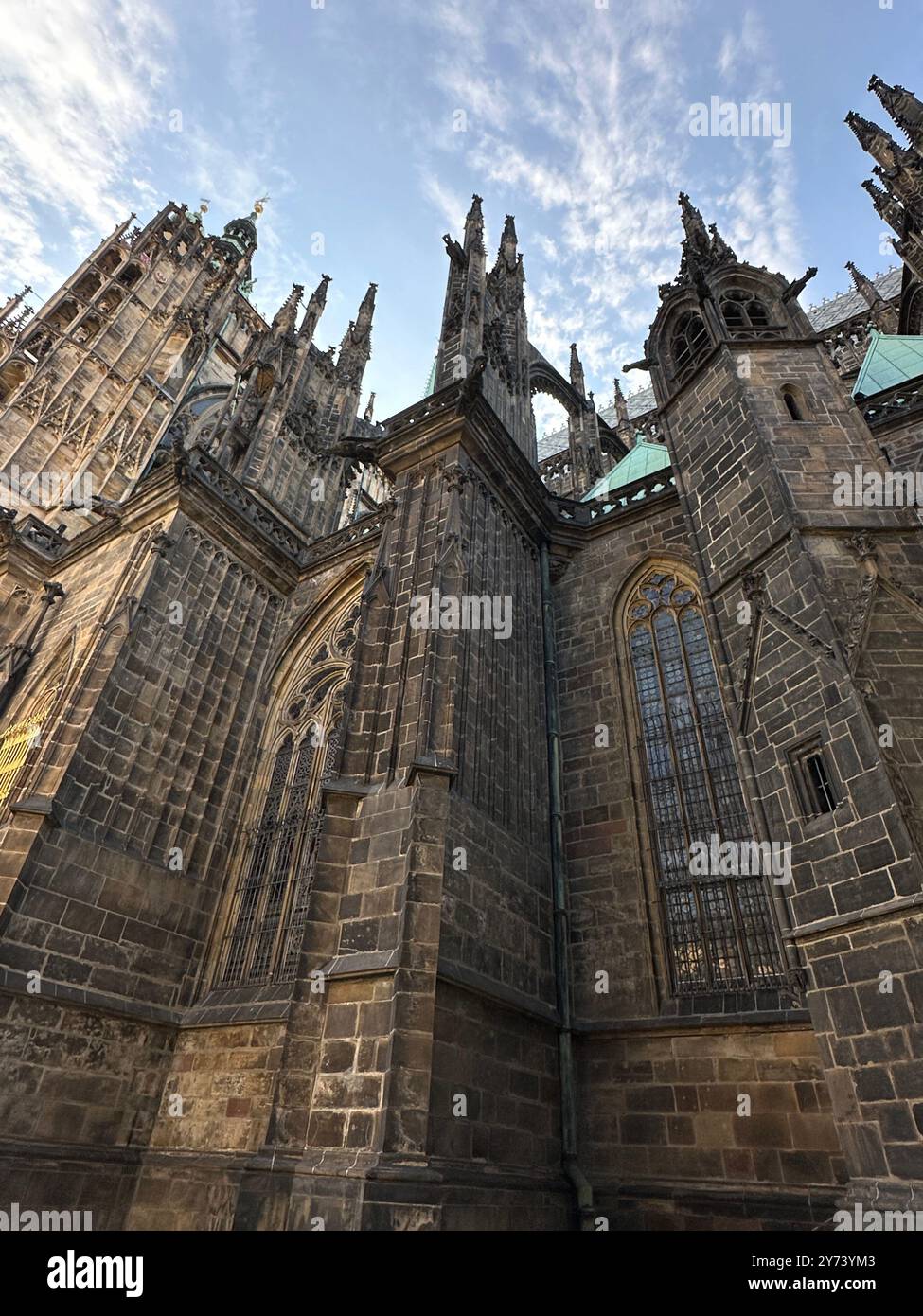 The photograph showcases a medieval European cityscape in summer, featuring vibrant rooftops and intricate architectural details. - Smartphone Captured Stock Image