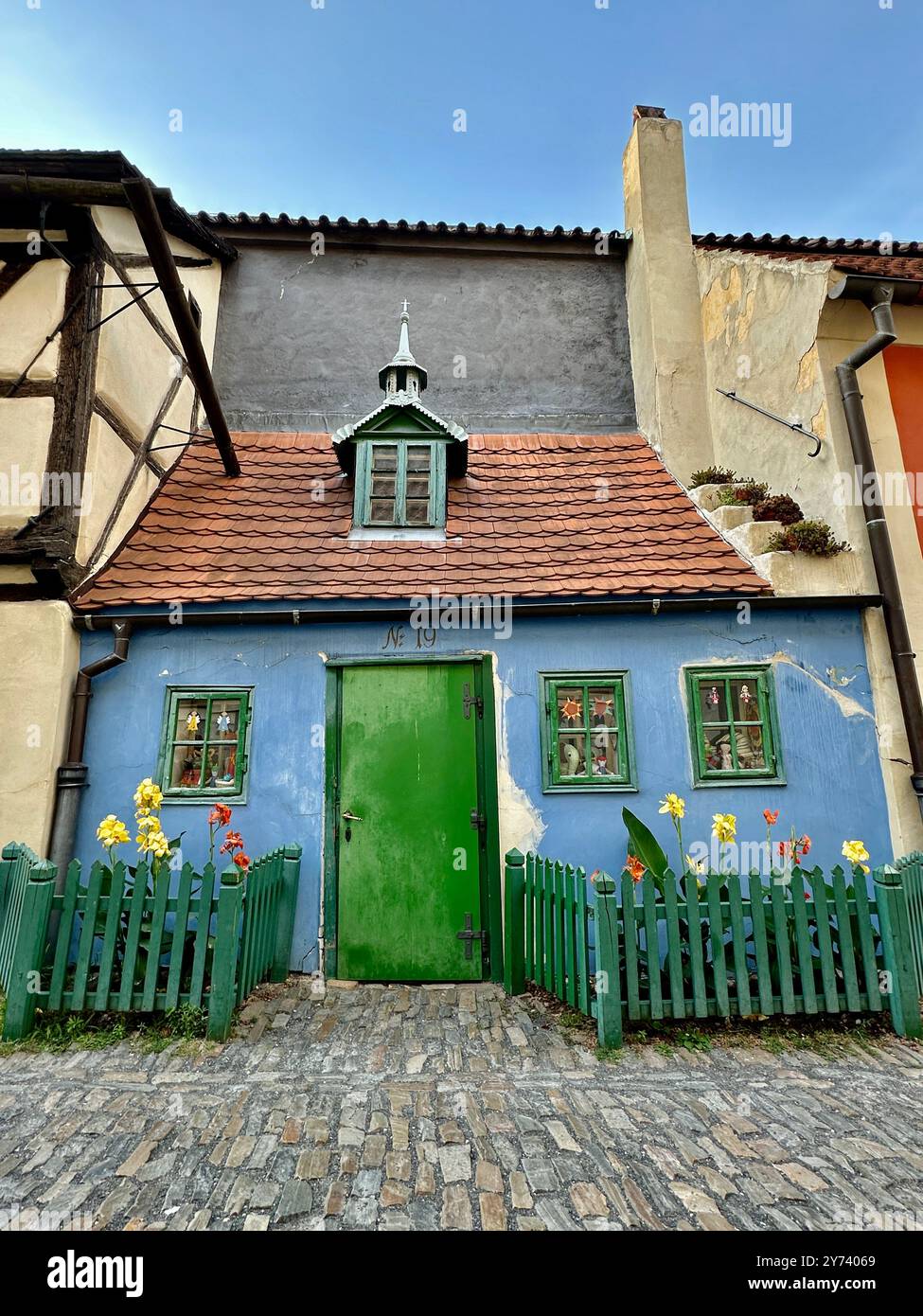 The photograph showcases a medieval European cityscape in summer, featuring vibrant rooftops and intricate architectural details. - Smartphone Captured Stock Image